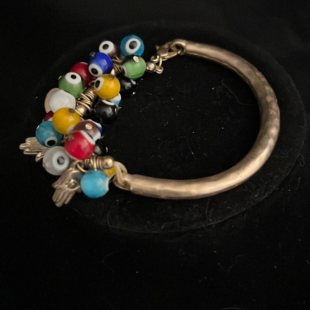 Amazingly beautiful Glass bead and Protection Charm Gold-tone clap Bracelet.